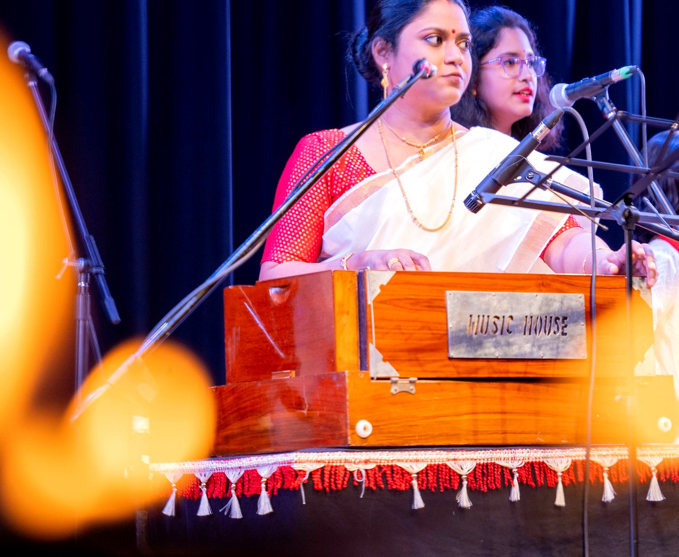 Geetabeethi students performing Indian classical vocal music on stage